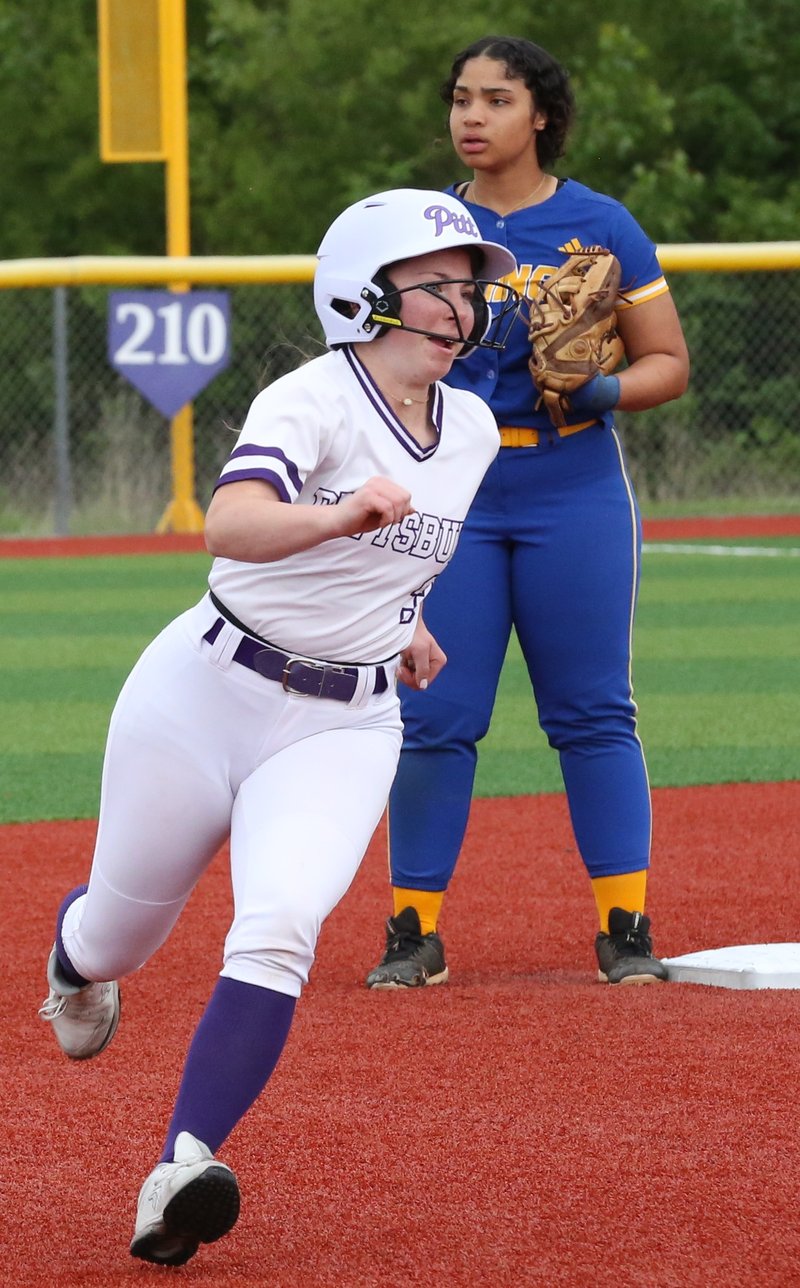 Pittsburg sophomore Laney Trisler rounds the bases on Peyton Morey's three-run double in the first inning Thursday against Parsons. BROCK SISNEY / THE MORNING SUN