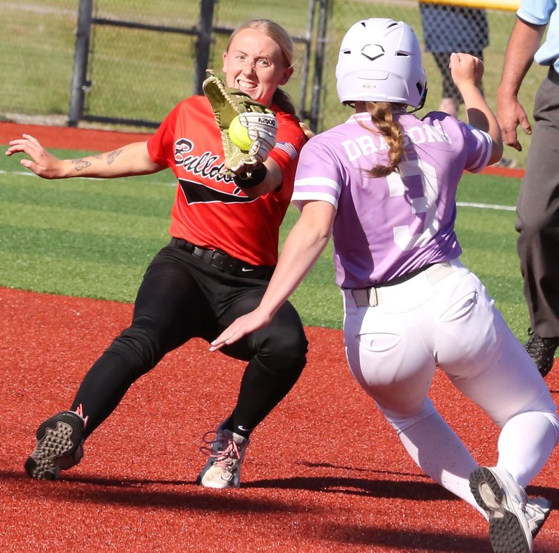 Pittsburg sophomore Laney Trisler slides in safely at second base Thursday as the ball starts to get away from her fellow shortstop, Independence's Jaidyn Price. BROCK SISNEY / THE MORNING SUN