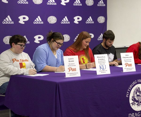 Students teacher signing