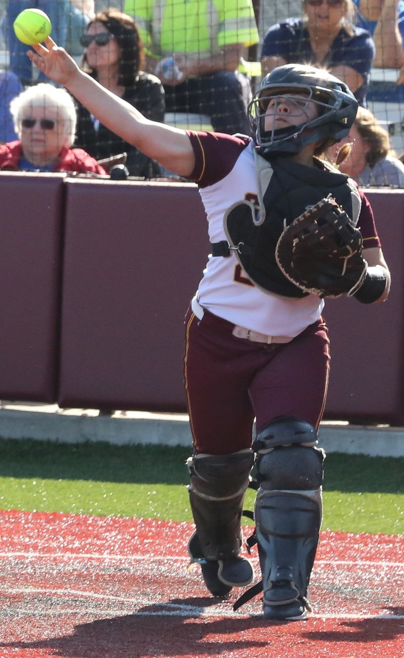 Girard freshman catcher Jazmyn Kaufman attempts to pick off a Colgan runner at third base