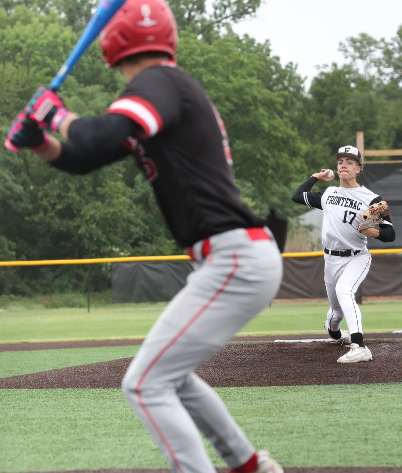 Pitcher delivers a pitch