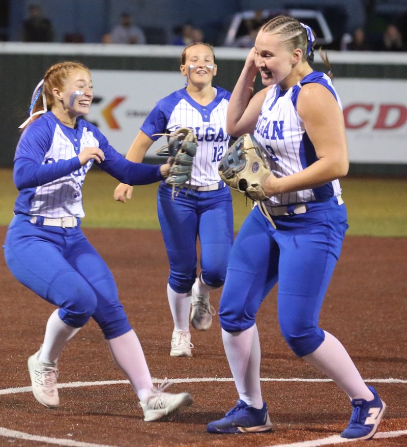 Softball players celebrate